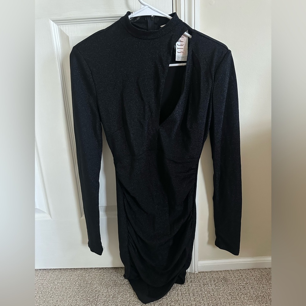 New dress with price tag. Top has cutter part , bottom is draped. Feels small